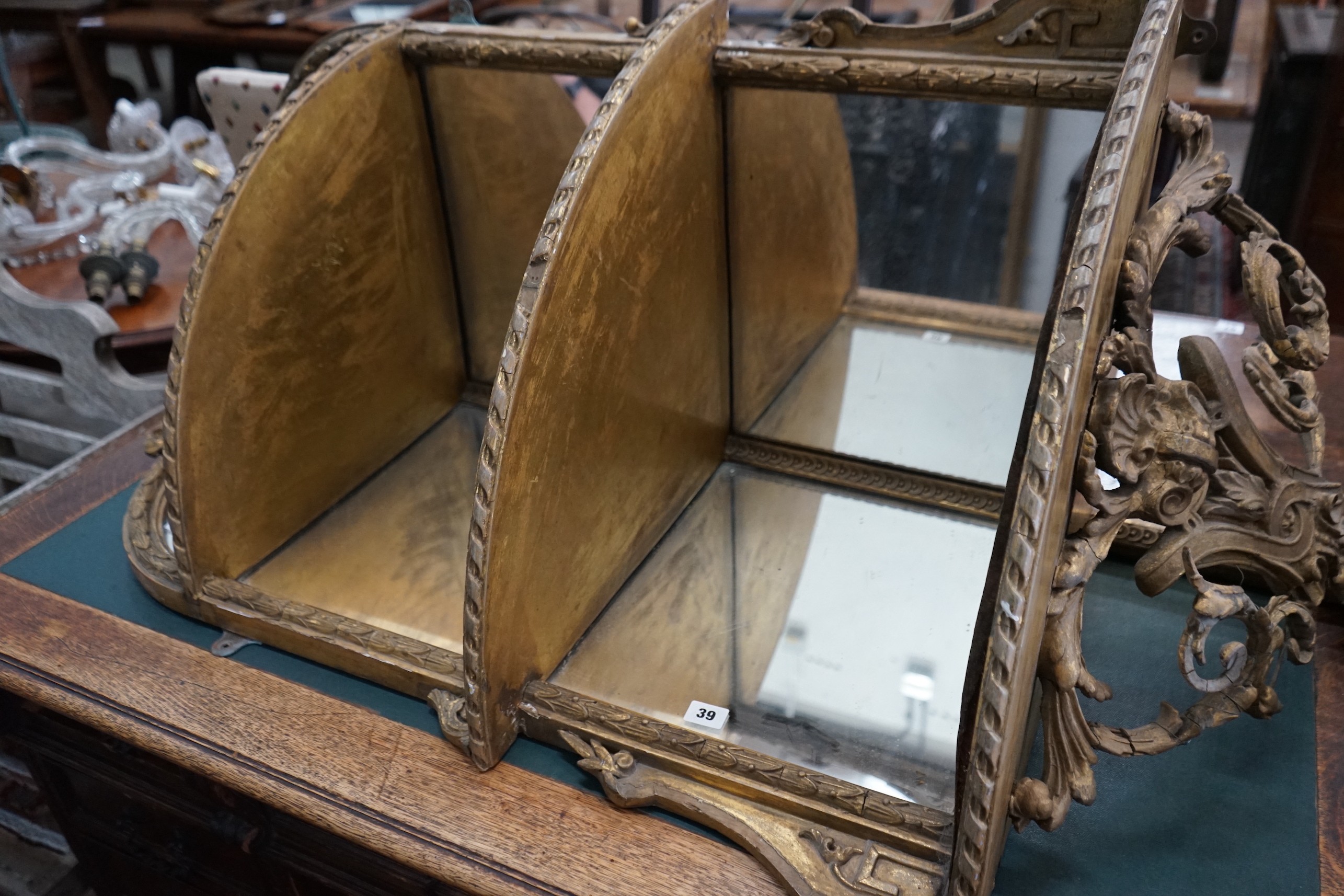 A Victorian giltwood and gesso mirrored corner wall bracket, width 74cm, depth 45cm, height 140cm